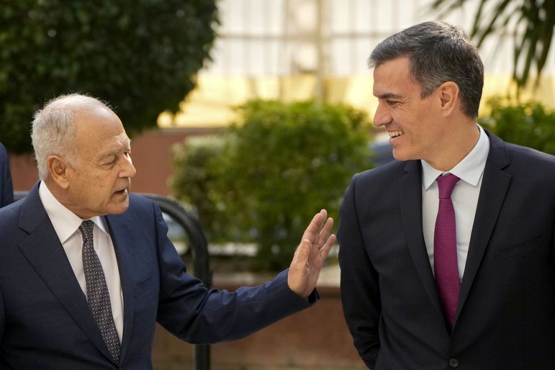 Arab League Secretary-General Ahmed Aboul Gheit, left, talks to Spanish Prime Minister Pedro Sanchez as he arrives at the Arab League headquarters in Cairo, Egypt, Friday.