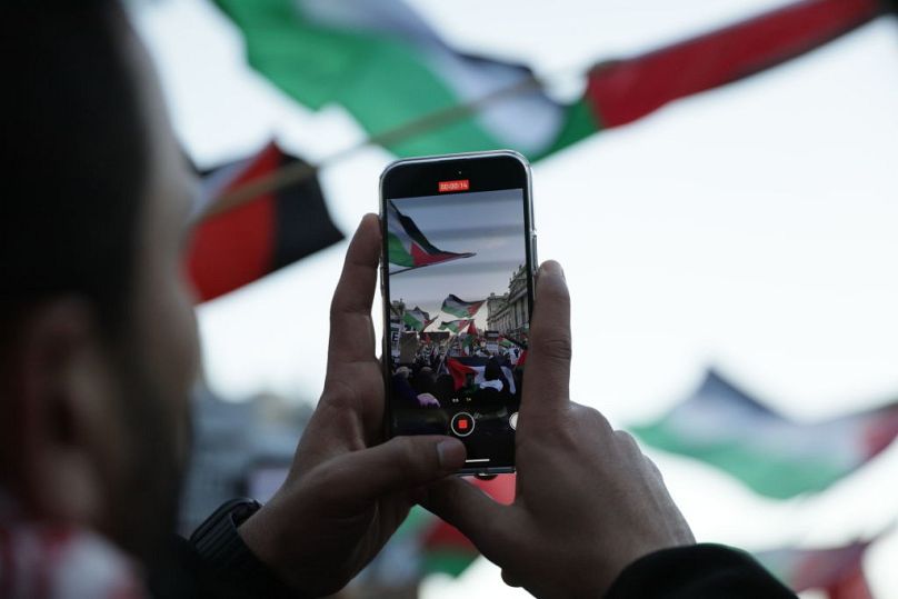Protestors march in solidarity with Palestine, demanding a ceasefire amid the ongoing conflict between Israel and the Palestinian Islamist group Hamas on Saturday