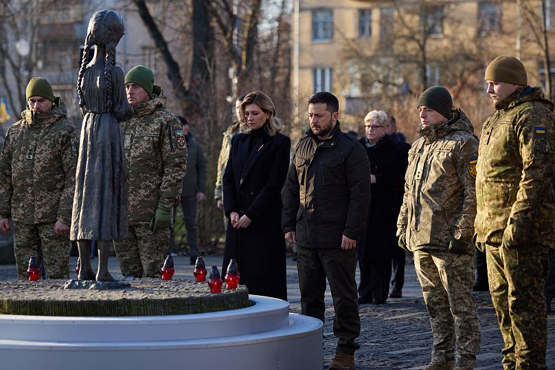 President Volodymyr Zelenskyy (C-R) and his wife Olena Zelenska (C-L) paying tribute to the victims of the famine of 1932-1933
