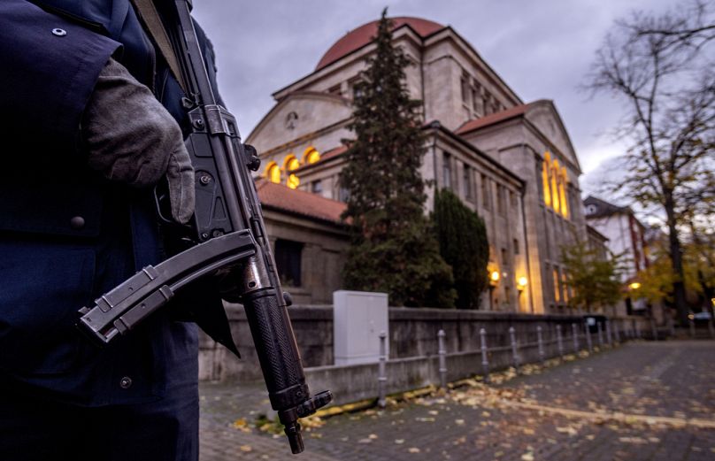 A German police officer stands guard in front of the synagogue in Frankfurt, Germany earlier this month