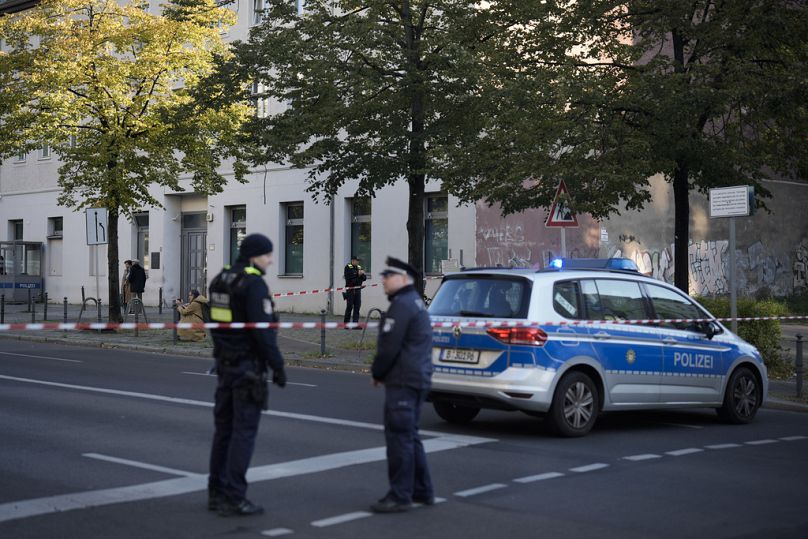 Police stand outside the Kahal Adass Jisroel community in Berlin which says its synagogue was attacked with two incendiary devices in October