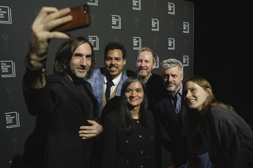 From left, writers Paul Lynch, Jonathan Escoffery, Chetna Maroo, Paul Murray, Paul Harding and Sarah Bernstein pose for a selfie at Booker Prize awards, 27 November, 2023.