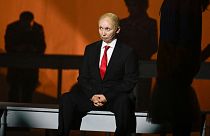 Bulgarian artist Radena Valkanova performs on stage in the role of Russian President Vladimir Putin, during the play "Haga" at the National Theatre Ivan Vzaov in Sofia. 