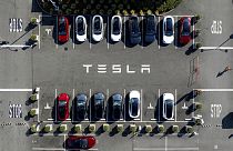 Tesla vehicles line a parking lot at the company's Fremont, Calif., factory, on Sept. 18, 2023. 