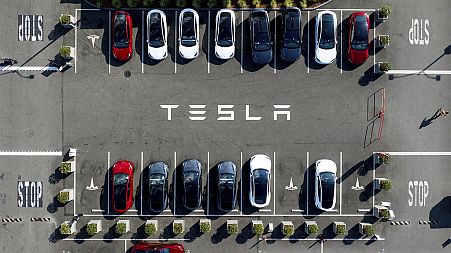 Tesla vehicles line a parking lot at the company's Fremont, Calif., factory, on Sept. 18, 2023. 