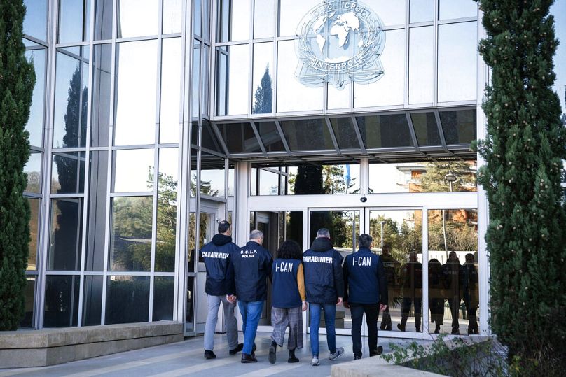 Italian carabinieri and anti-Ndrangheta police officers arrive at the Interpol headquarters in Lyon, central France, Thursday, Feb.2, 2023.