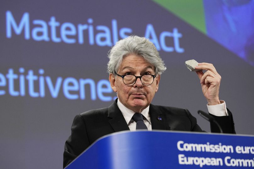 European Commissioner for Internal Market Thierry Breton holds up raw materials during a media conference in Brussels, March 2023