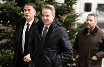 Prime Minister of Greece Kyriakos Mitsotakis, center, arrives at BBC Broadcasting House to appear on a BBC TV programme in London, 26 November 2023