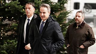 Prime Minister of Greece Kyriakos Mitsotakis, center, arrives at BBC Broadcasting House to appear on a BBC TV programme in London, 26 November 2023