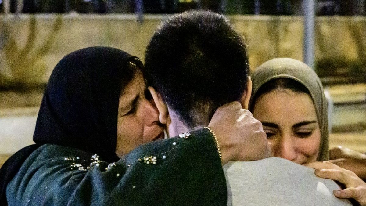 A former Palestinian prisoner (C) is greeted by relatives after being released in exchange for Israeli hostages held by Hamas, 27/11/23.