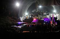 Ambulances drive out of the tunnel carrying rescued workers in Silkyara in the northern Indian state of Uttarakhand, India, Tuesday, Nov. 28, 2023.