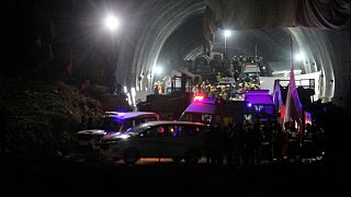 Ambulances drive out of the tunnel carrying rescued workers in Silkyara in the northern Indian state of Uttarakhand, India, Tuesday, Nov. 28, 2023.