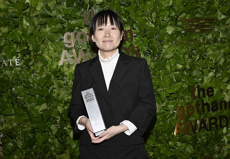 Celine Song poses with the award for best feature for Past Lives at the Gotham Independent Film Awards