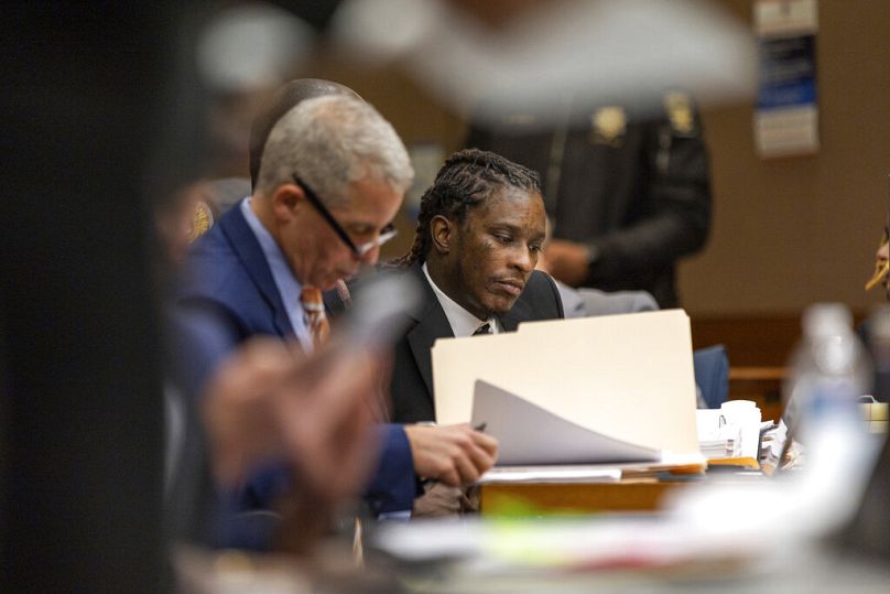 Atlanta rapper Young Thug, center, whose real name is Jeffery Williams, makes his first appearance at the Fulton County courthouse in Atlanta on Thursday, Dec. 15, 2022.