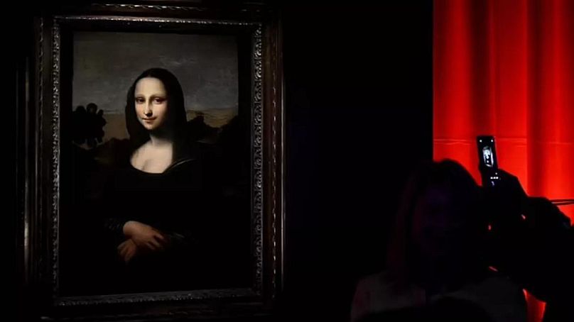 Visitor looks at the Isleworth Mona Lisa during the exhibition “Leonardo Da Vinci – La Prima Monna Lisa”.
