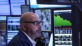 Trader works on the floor of the New York Stock Exchange