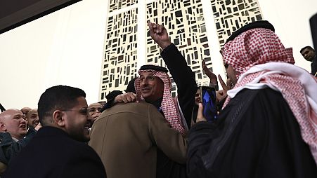 Membri della delegazione saudita festeggiano la vittoria di Riad nella gara per aggiudicarsi l'Expo 2030