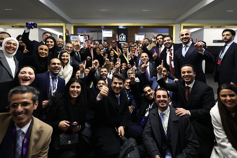 Members of the Saudi delegation celebrate after the Bureau International des Expositions, or BIE, announced the vote Tuesday, Nov. 28, 2023 in Paris