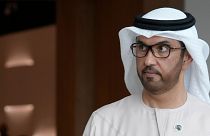 COP28 President Sultan al-Jaber walks through the venue ahead of the UN climate summit. 