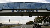A trucks passes below a walkway at the General Motors Oshawa, Canada assembly plant
