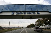 A trucks passes below a walkway at the General Motors Oshawa, Canada assembly plant
