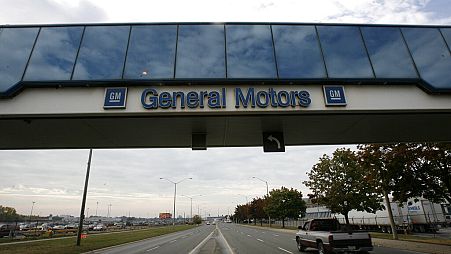 A trucks passes below a walkway at the General Motors Oshawa, Canada assembly plant