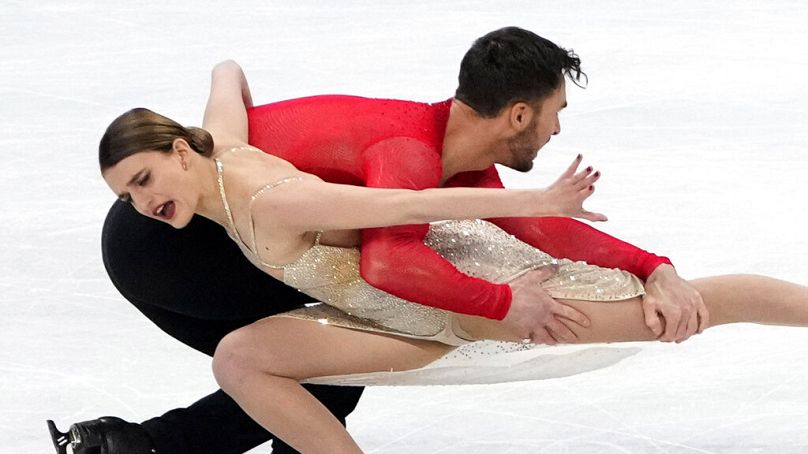 Gabriella Papadakis and Guillaume Cizeron, of France, perform their routine in the ice dance competition during the figure skating at the 2022 Winter Olympics, Monday, Feb. 14