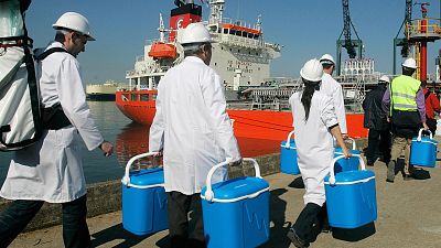 Technical personnel enter a ship loaded with drinking water docked in Barcelona, Spain on 13 May 2008 as part of an unprecedented emergency plan to alleviate a drought. 