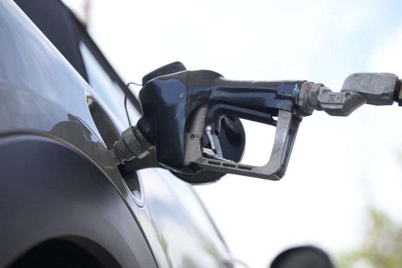 A motorist fills up a vehicle at a Shell gasoline station, June 2023
