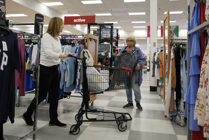 Customers shop at a retail store in Vernon Hills, Ill, June 2023