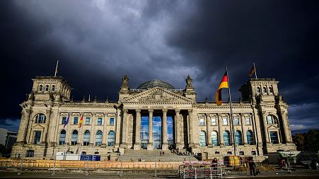 Rain clouds gather over the Reichstag building which houses Germany's lower house of parliament (Bundestag) in Berlin on September 28, 2022.