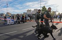 Israeli border policemen secure the shooting attack site in Jerusalem , Thursday, Nov. 30, 2023.