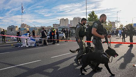 Israeli border policemen secure the shooting attack site in Jerusalem , Thursday, Nov. 30, 2023.