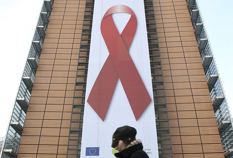 A giant banner with the AIDS awareness red ribbon is displayed on World AIDS Day, at the European Commission building in Brussels in 2009.