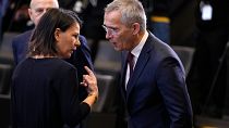 Germany's Foreign Minister Annalena Baerbock, left, speaks with NATO Secretary General Jens Stoltenberg at NATO headquarters in Brussels, Nov. 29, 2023.