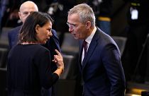 Germany's Foreign Minister Annalena Baerbock, left, speaks with NATO Secretary General Jens Stoltenberg at NATO headquarters in Brussels, Nov. 29, 2023.