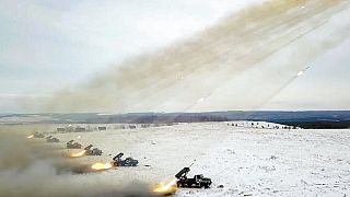 FILE - Russian Defense Ministry Press Service, Russian rocket launchers fire during military drills near Orenburg in the Urals, Russia, Thursday, Dec. 16, 2021. 