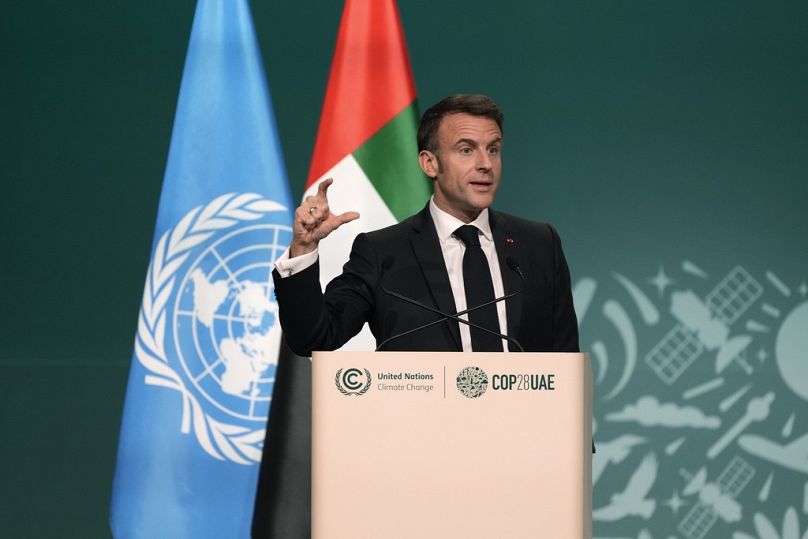 France President Emmanuel Macron speaks during a plenary session at the COP28 UN Climate Summit in Dubai, December 2023