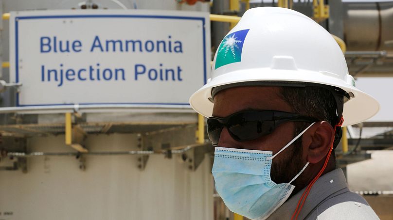 A Saudi Aramco engineer stands in front of the blue ammonia injection point at the Hawiyah Natural Gas Liquids Recovery Plant, Saudi Arabia, June 2021.