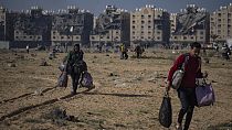 Palestinians flee from their neighbourhood in Khan Younis, Gaza Strip, during the ongoing Israeli bombardment, Saturday, Dec. 2, 2023. 
