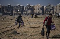 Palestinians flee from their neighbourhood in Khan Younis, Gaza Strip, during the ongoing Israeli bombardment, Saturday, Dec. 2, 2023. 