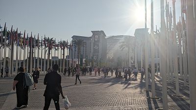 Attendees walking into the COP28 climate conference in Dubai.