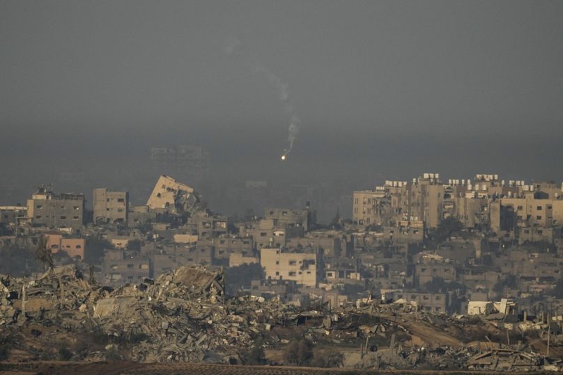 An Israeli army flare is seen over the Gaza Strip, as seen from southern Israel, Sunday, Dec. 3, 2023.