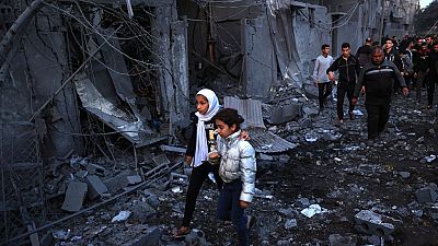 Palestinians check the damages after an Israeli strike in Rafah in the southern Gaza Strip on Sunday, amid continuing battles between Israel and Hamas