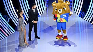Albärt, the official mascot of UEFA EURO 2024, takes to the stage during the UEFA EURO 2024 Final Tournament Draw at Elbphilharmonie on Saturday