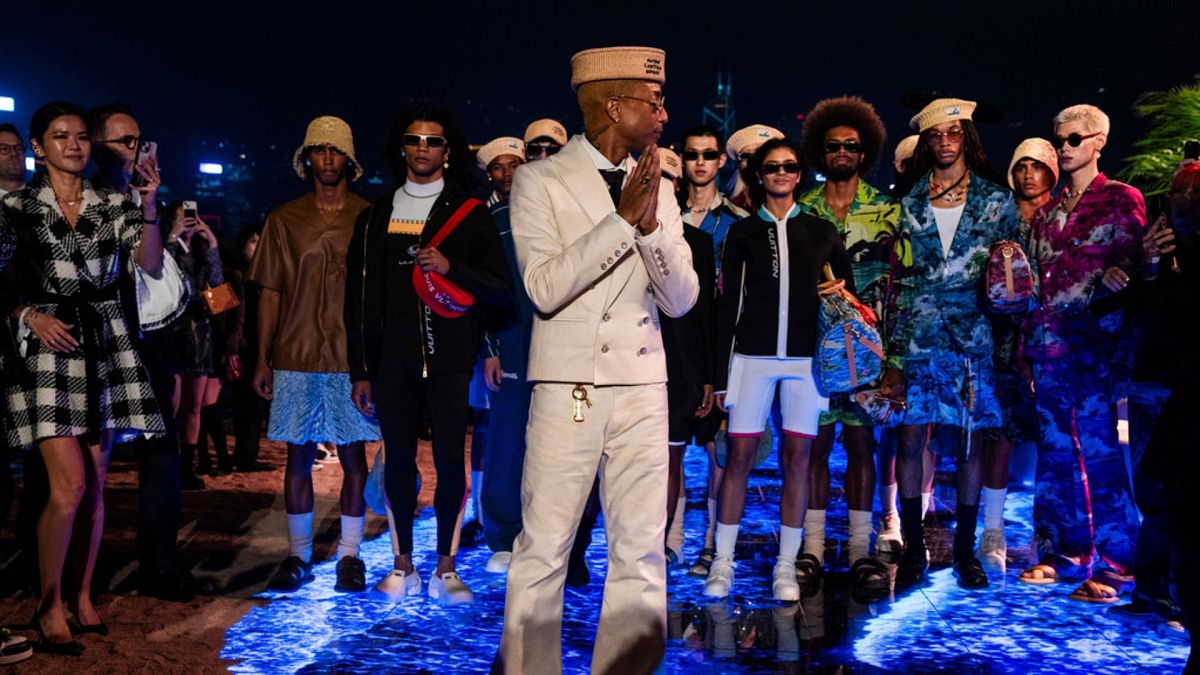 Designer Pharrell Williams reacts at the conclusion of the Louis Vuitton Men's Pre-Fall 2024 Fashion Show presented in Hong Kong, Thursday, Nov. 30, 2023.