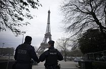 French policemen patrol near the Eiffel Tower 