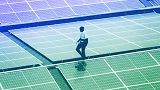 Mark Munyua, CP solar's technician, examines solar panels on the roof of a company in Nairobi, September 2023