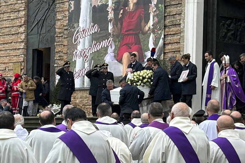 Pallbearers carry the coffin of Giulia Cecchettin during her funeral, at the Church of Santa Giustina in Padua, Italy, Tuesday Dec. 5, 2023.