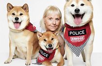 Karen with Dennis, Riot and Rosie from 'A Celebration of Dogs with Jobs', a new exhibition in London. 